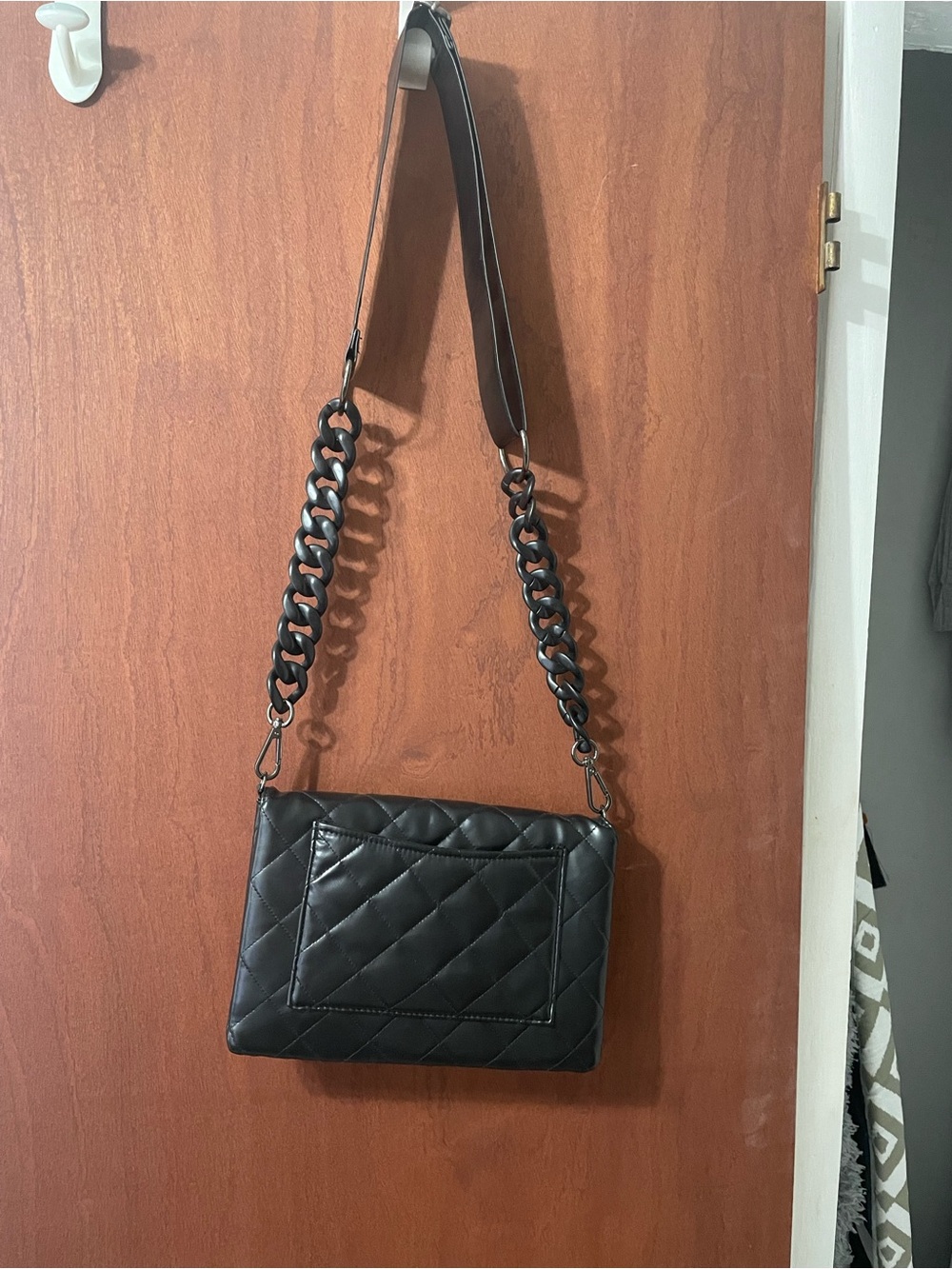 Haute Shore Quilted Black Shoulder Bag with Chain Detail. Designer. Expensive.